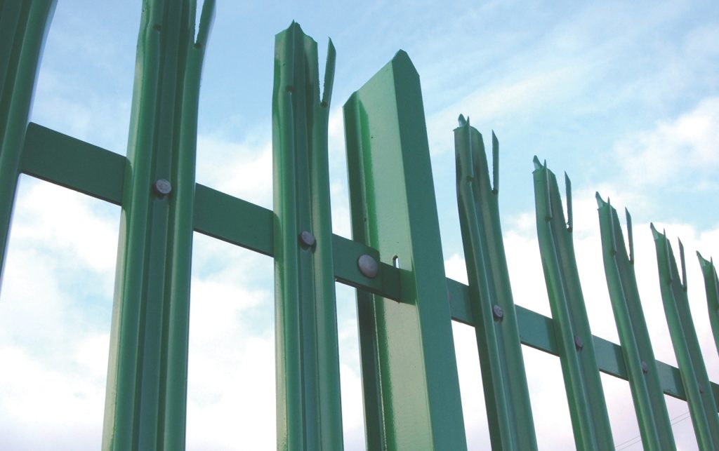 A fence that has been powder coated green