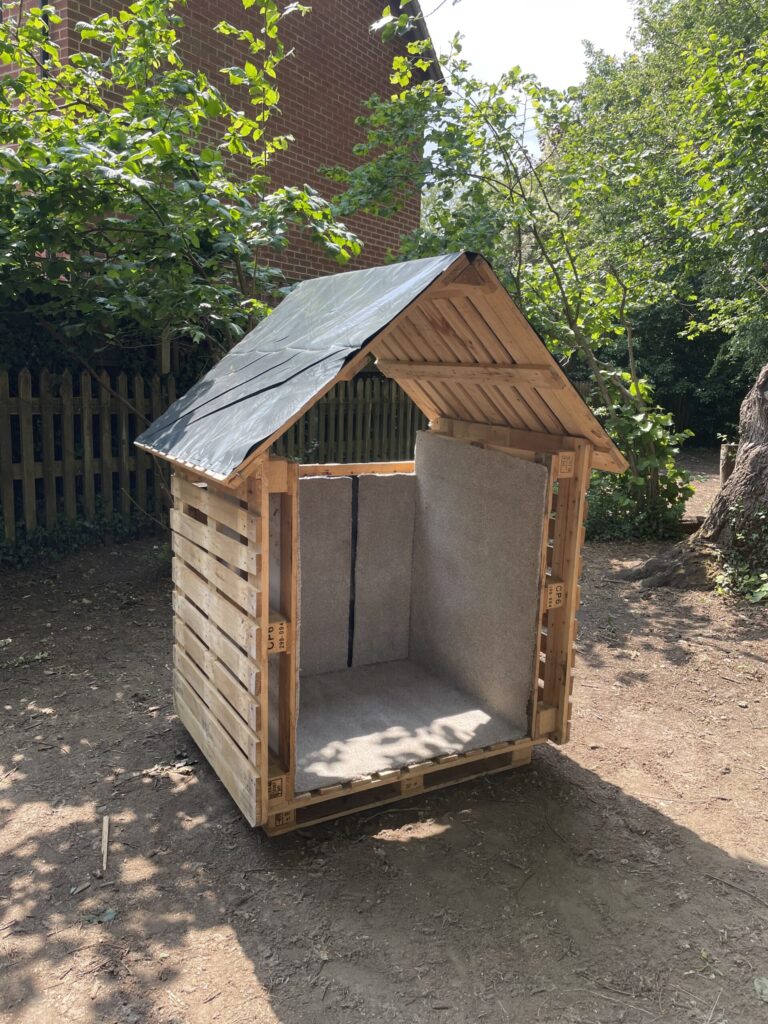 Den made from donated pallets